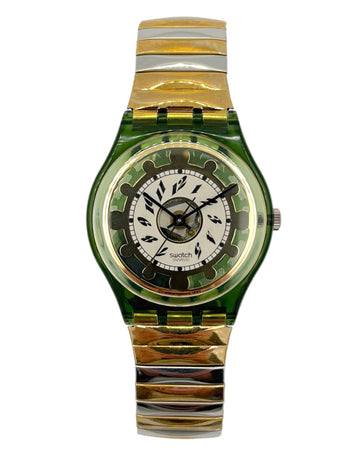A Swatch wristwatch featuring a translucent green case and a two-tone green, gold, and silver striped metal link bracelet, with a white dial.