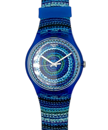 Blue Swatch watch with a patterned strap on a white background
