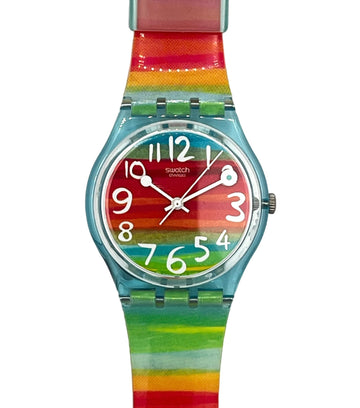 Swatch watch with a colorful rainbow striped strap and a matching multicolor dial on a white background.