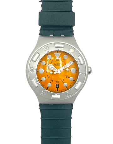 A wrist watch with a dark teal-green textured strap, a silver-tone case, and a vibrant orange dial with white hands and markers.