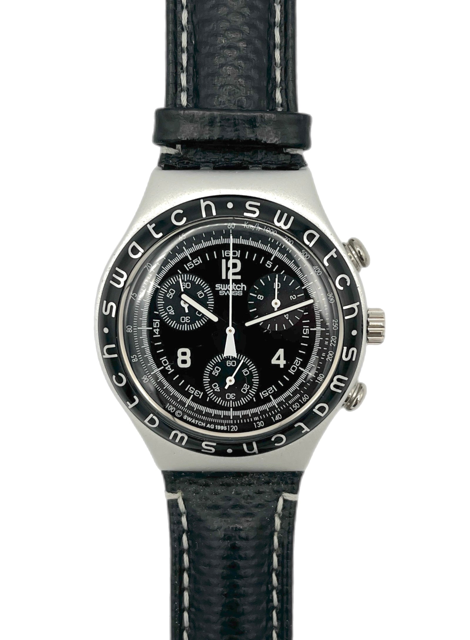 Swatch watch with black face and leather strap on a white background