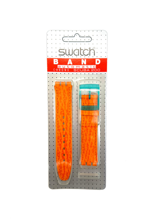 An orange textured silicone watch band by Swatch, shown in its original retail blister packaging against a white background.