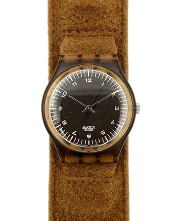 Watch with a brown strap and black face on a white background