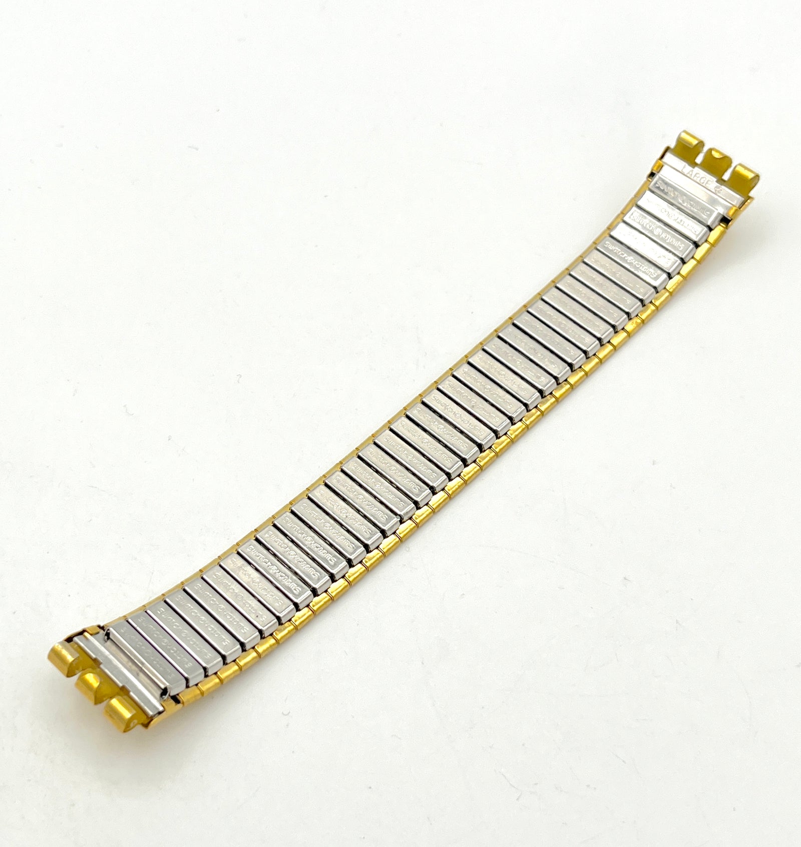 Correa de repuesto Swatch de metal flexible dorada de 17 mm