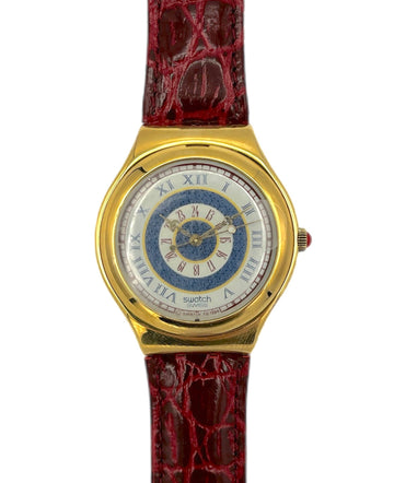 Gold watch with a red strap on a white background