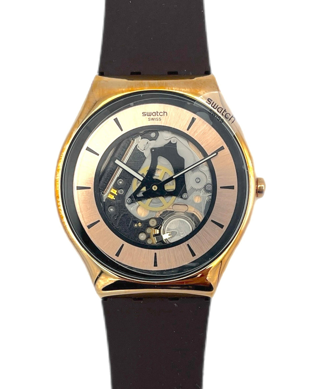 Swatch watch with black strap and gold case on a white background