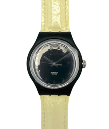 Watch with black case and beige strap on a white background