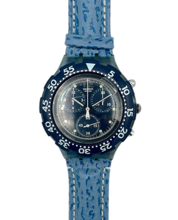 Blue watch with a textured strap on a white background