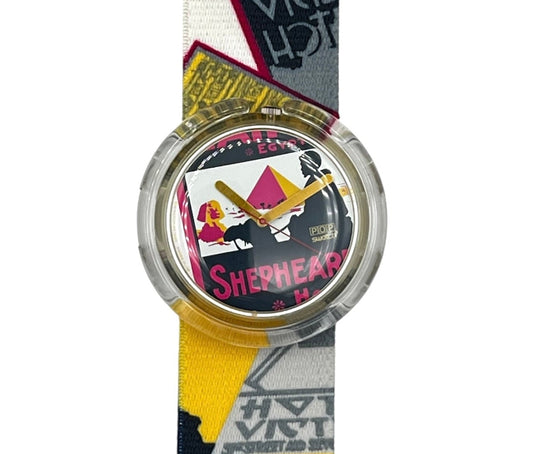 A wristwatch with a colorful graphic strap featuring 'Sherlock Holmes' text and illustrations, shown against a plain white background.