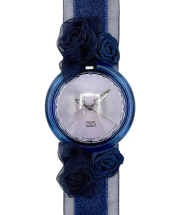 Wristwatch with blue floral straps on a white background