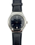 Wristwatch with black leather strap and dark face on a white background