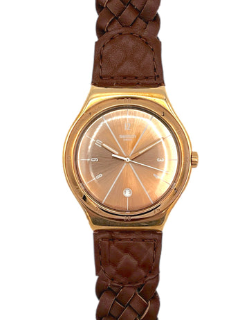 Gold watch with brown braided strap on a white background
