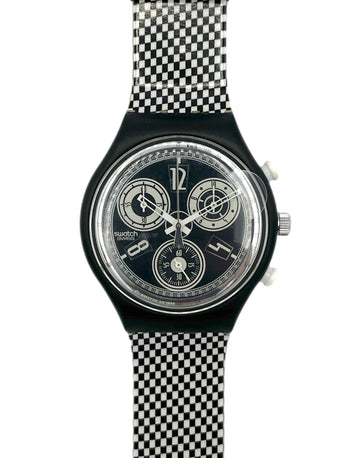 Swatch watch with black and white checkered strap on a white background