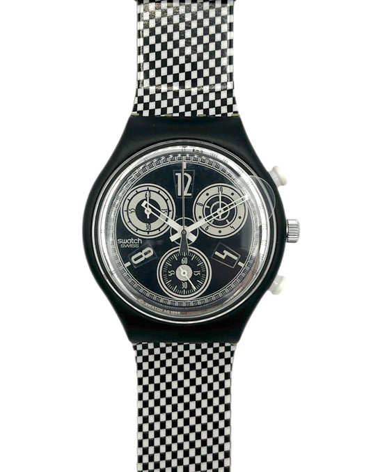 Swatch watch with black and white checkered strap on a white background