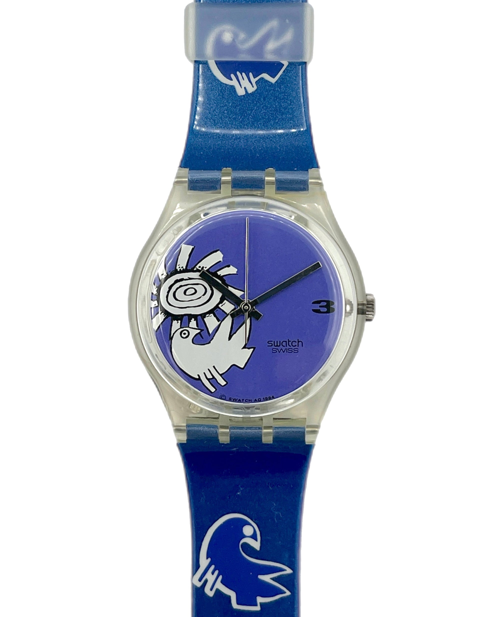 Blue Swatch watch with a clear face on a white background