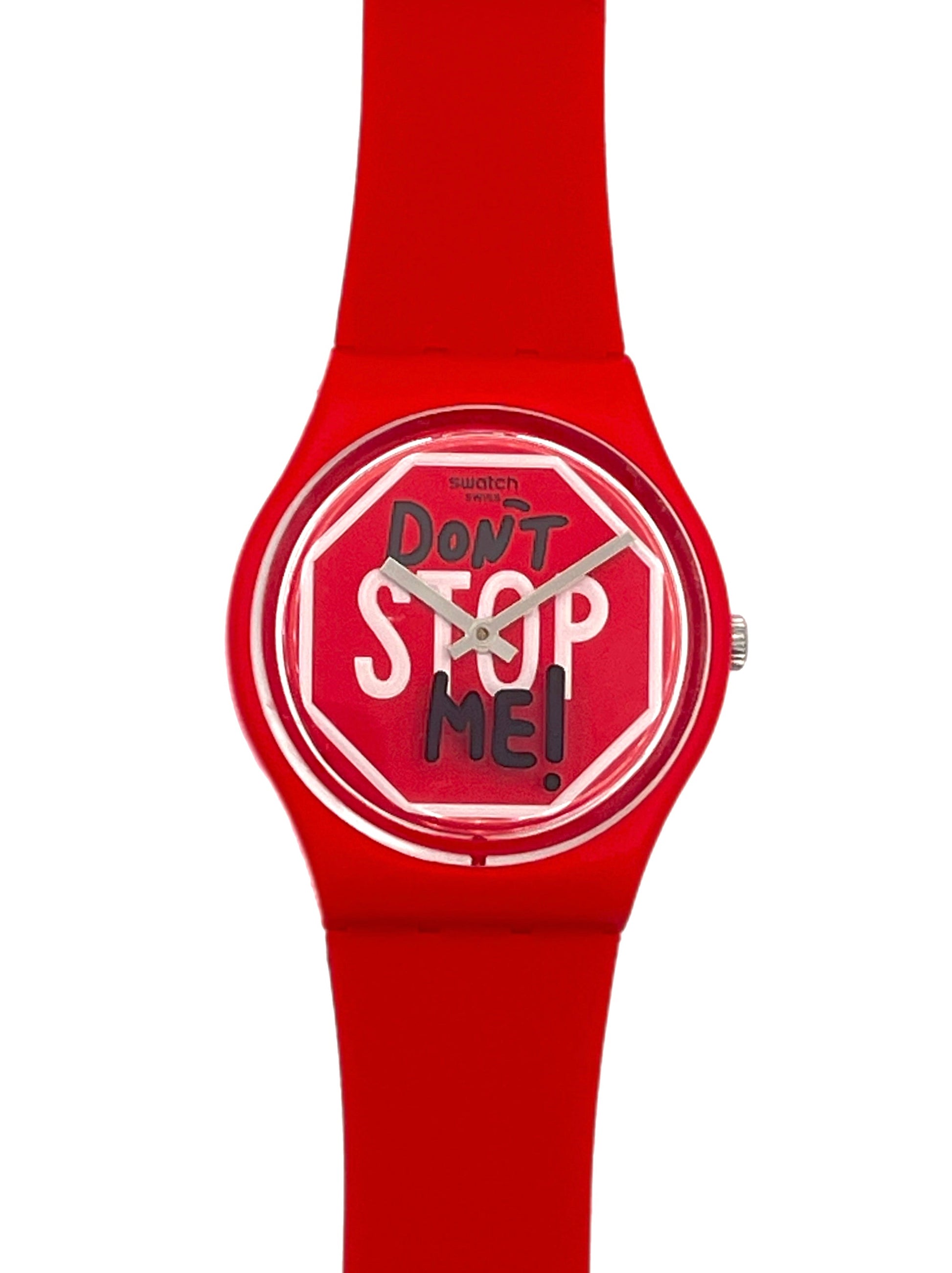 A red silicone watch with a round dial featuring the text 'Don't Stop Me!' in white and black on a red stop-sign motif, shown against a plain white background.