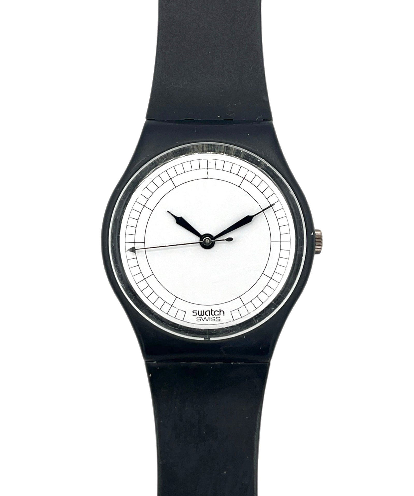 A Swatch wristwatch with a black silicone strap, black case, and a minimalist white dial with black hands.