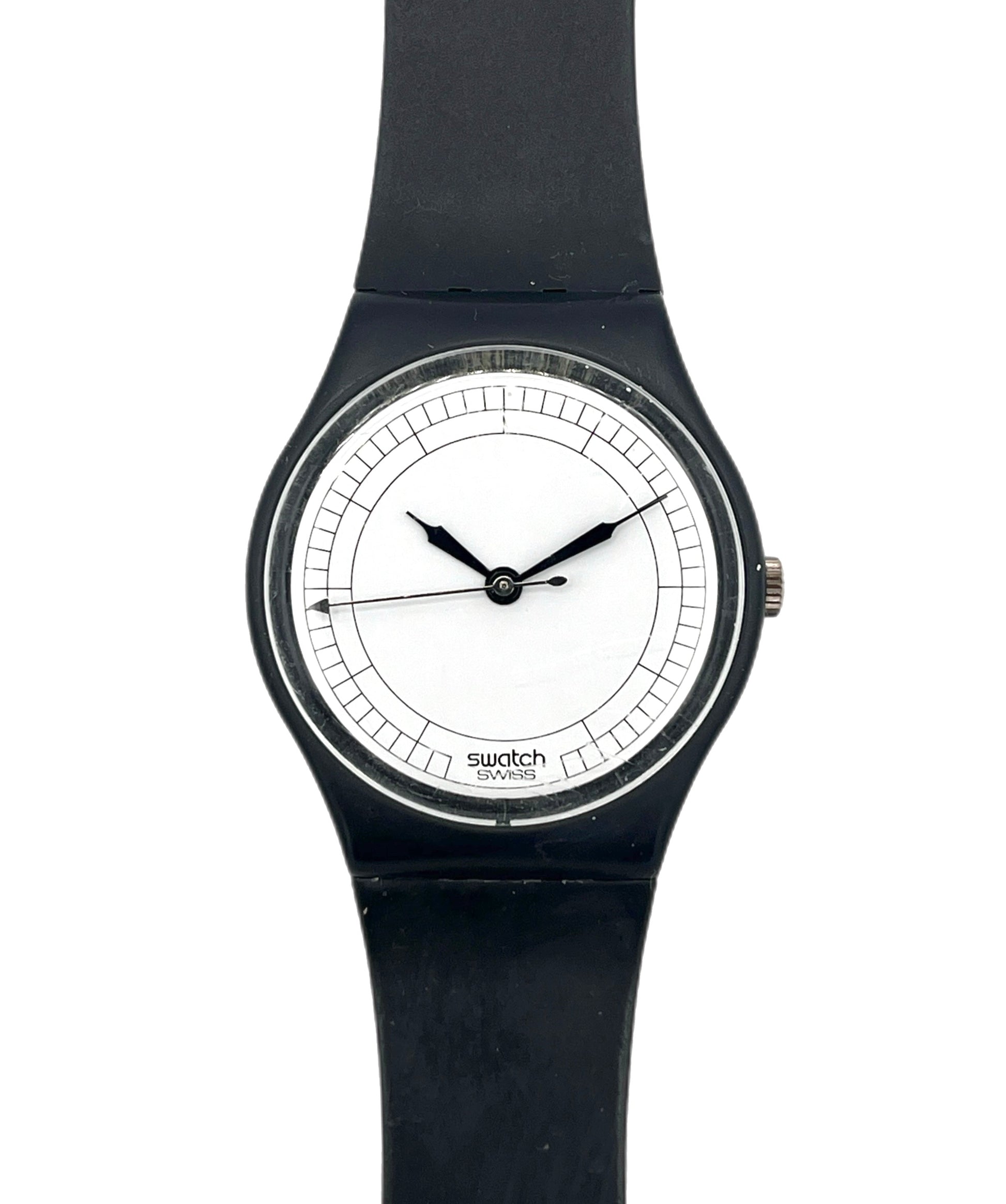 A Swatch wristwatch with a black silicone strap, black case, and a minimalist white dial with black hands.
