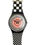 A wristwatch with a black and white checkered strap, a black case, and a glittery silver dial featuring a pink center circle with a black logo.