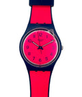 Wristwatch with red and blue strap on a white background