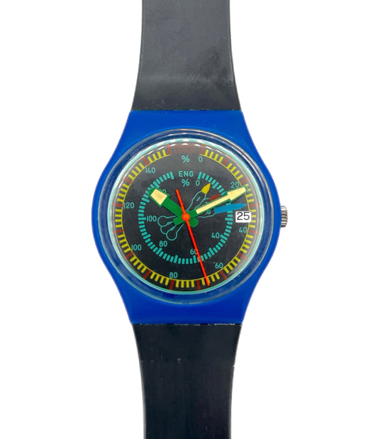 A Swatch wristwatch with a bright blue case, black strap, and a colorful dial featuring yellow, green, and red accents.