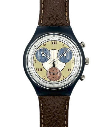 Watch with a brown leather strap and multicolored face on a white background