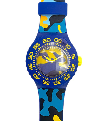 A kids' silicone watch with a blue, yellow, and black camouflage pattern strap and case, featuring a yellow dial with a cartoon character.