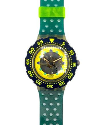 Swatch watch with green strap and yellow face on a white background