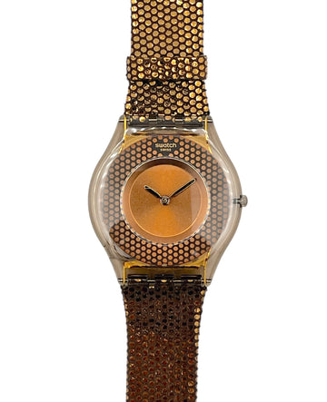 Gold watch with a textured band on a white background
