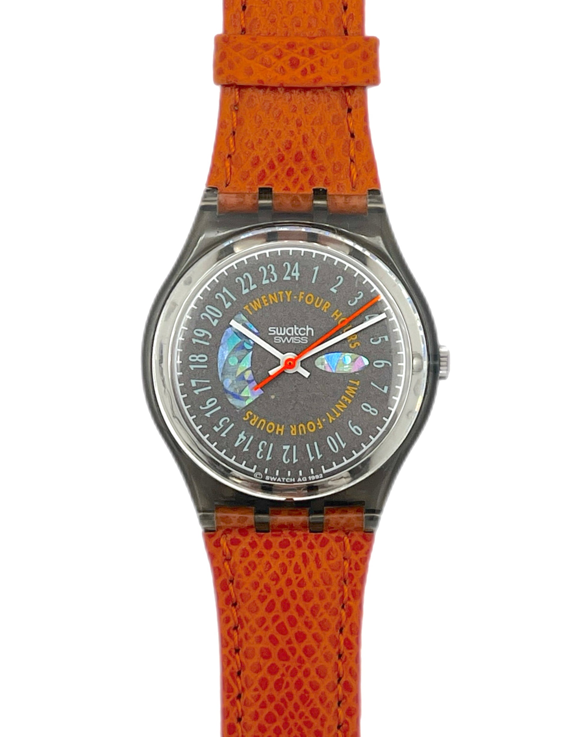 Swatch watch with orange strap and gray dial on a white background