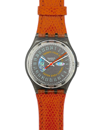 Swatch watch with orange strap and gray dial on a white background