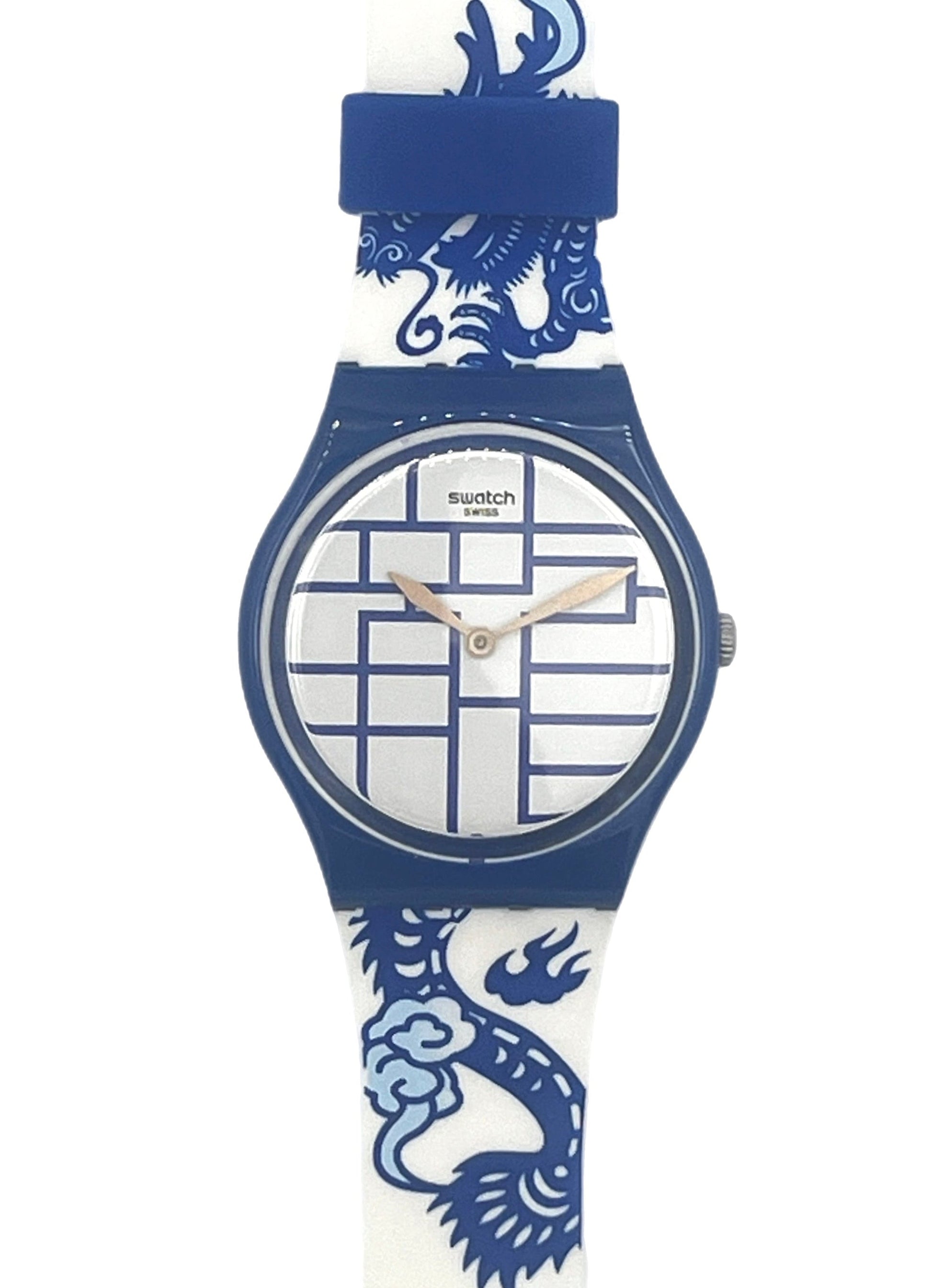 Swatch wristwatch with a blue and white dragon patterned strap and a blue round case, shown on a plain white background.