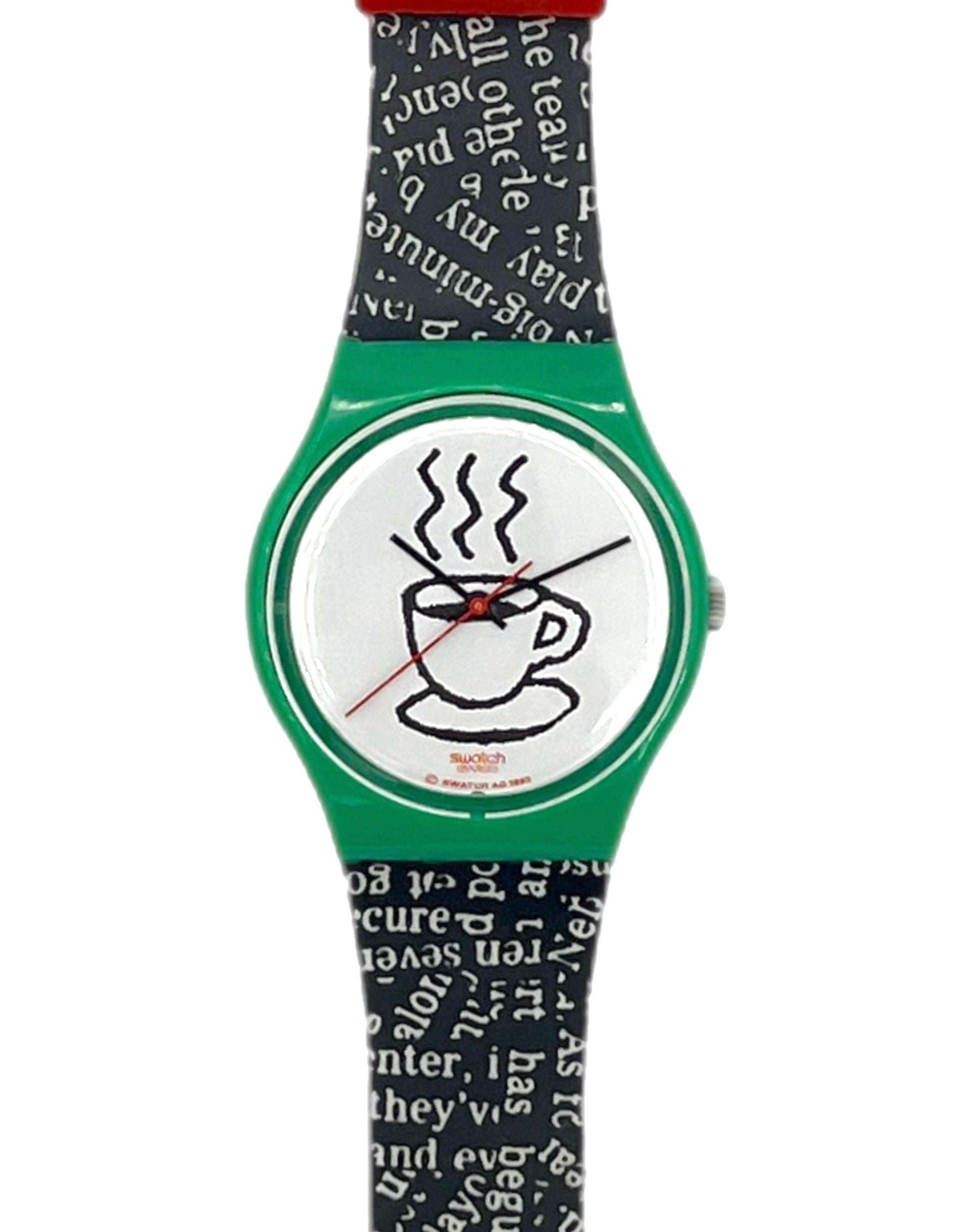 A Swatch wristwatch featuring a green case, a white dial with a black coffee cup illustration, and a black and white patterned strap.