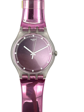 Swatch wristwatch with a glossy metallic pink strap and a matching pink dial, featuring a silver-tone case and white hands.