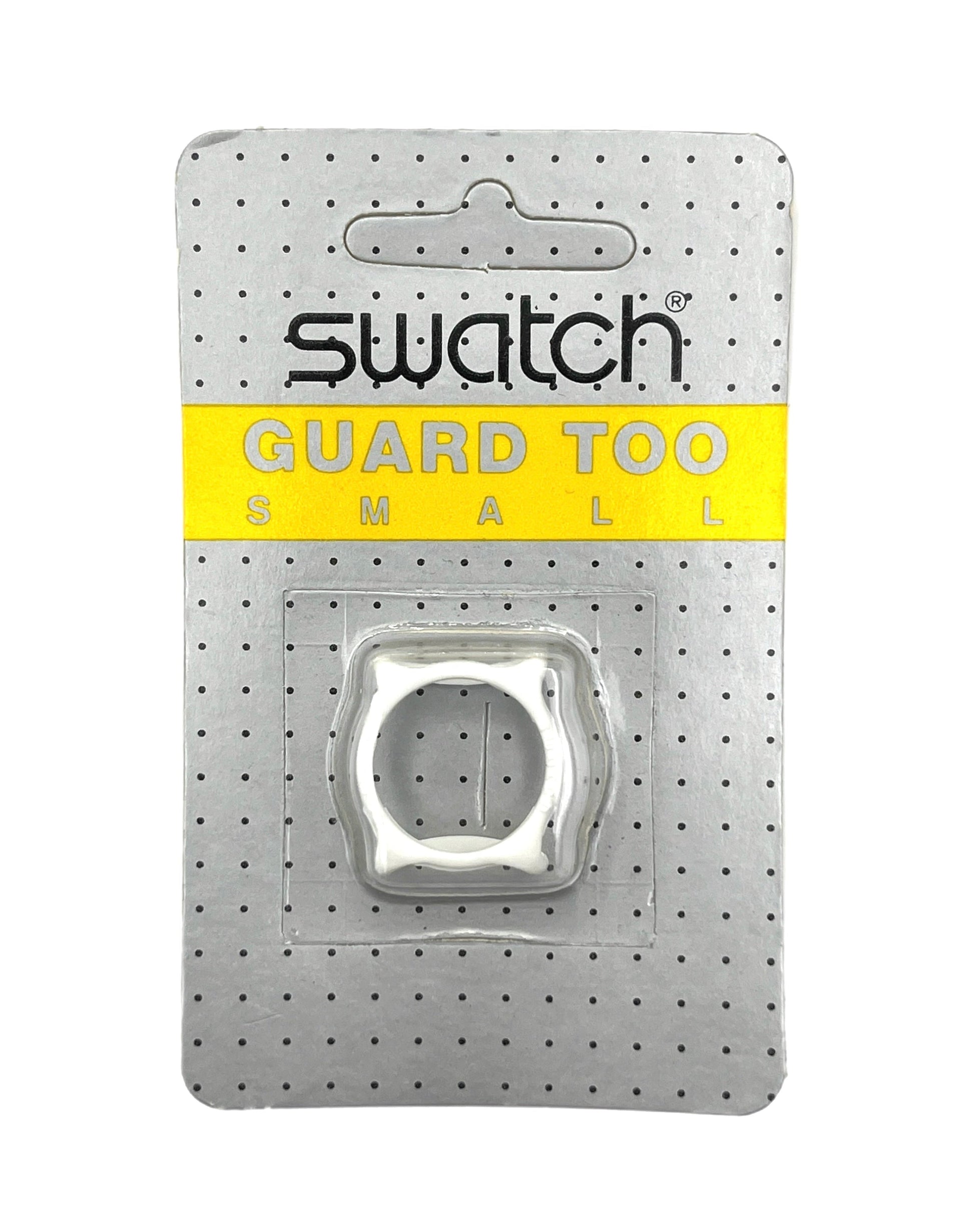A small Swatch Guard Too ring in its original retail blister packaging, featuring a silver metal ring inside a clear plastic bubble on a perforated gray backing card with a yellow band.